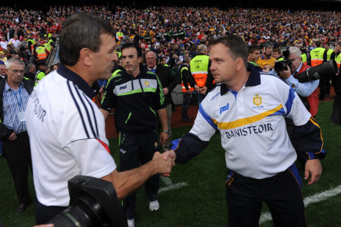 Clare manager David Fitzgerald meets with Cork manager Jimmy Barry Murphy following the All-Ireland senior hurling final at Croke Park. Photograph by John Kelly.