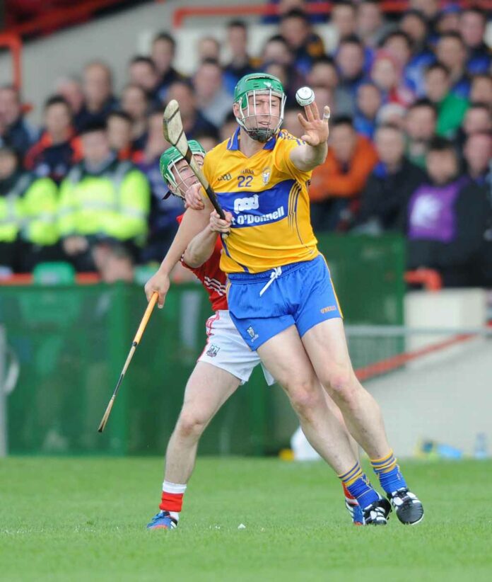 Fergal Lynch of Clare in action against Daniel Kearney of Cork during their Munster senior championship semi-final in The Gaelic Grounds. Photograph by John Kelly.