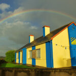 House painted saffron and blue at Knockerra.