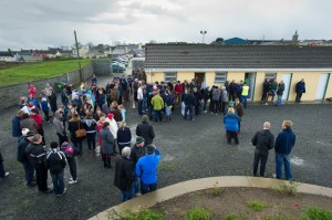 Football fans wait for the outcome out side the dressing rooms at Kilmihil  for the county football quarter final. Photograph by John Kelly.