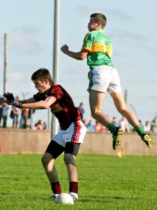 St Joseph's Conor Cleary is outjumped by Kilmihil's Jack Browne during their Intermediate Football Final at Cooraclare.