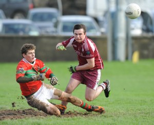 Padraig Greene of Kilmurry Ibrickane in action against Niall Meere of Lissycasey during their Minor Division One county football final at Cooraclare. Photograph by John Kelly.