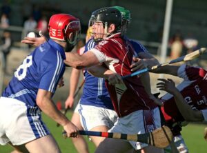 St Josephs Cathal O'Sullivan gets his pass away under pressure from Cratloes Sean Collins and Damian Browne during their Senior Hurling Championship round 2 match at Cusack Park. Photo Arthur Ellis.