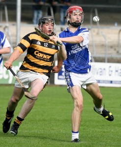 Kilmaley's Michael O'Malley gets away from Tubber's David O'Donoghue during their SHC round 2 match at Cusack Park. Photograph Arthur Ellis.