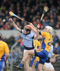 David Dempsey of Na Piarsaigh in action against John Fennessy of Sixmilebridge during the Munster Club Championship final at Cusack park. Photograph by John Kelly.