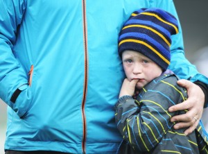 Young Sixmilebridge fan Fionn Hayes, son of selector Pat Hayes is clearly dissapointed with the club's defeat by Na Piarsaigh following the the Munster Club Championship final at Cusack park. Photograph by John Kelly.