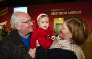 Little Kyra Kenihan is greeted by her grandparents Eddie and Bridgid Kenihan of Corbally, after meeting her for the first time in person at Shannon Airport on her arrival home for Christmas from Sydney. Photograph by John Kelly.