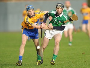 Bobby Duggan of Clare in action against Richie English of Limerick during the Waterford Crystal quarter final at Sixmilebridge. Photograph by John Kelly.