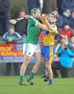 Stephen Walsh of Limerick in action against David Reidy of Clare during the Waterford Crystal quarter final at Sixmilebridge. Photograph by John Kelly.