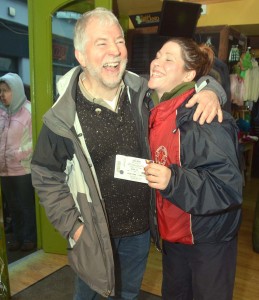 Answered prayers - Nora Murphy from Kilkishen receives the first Garth Brooks tickets sold in Ennis this morning from Dave Woodford, The Irish Shop.