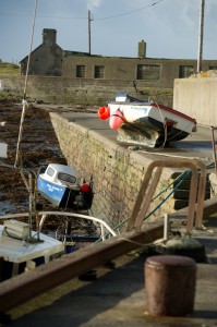 A view of  a boat which was lifted up onto the pier at Seafield, Quilty during the storm. Photograph by John Kelly.