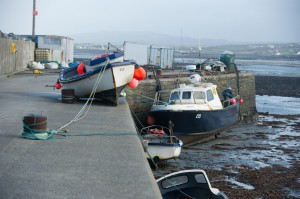 A view of  a boat which was lifted up onto the pier at Seafield, Quilty during the storm. Photograph by John Kelly.