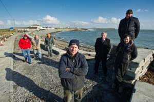 Timmy Dooley TD with Kilbaha locals including, local business man Bernie Keating, front, Cillian Murphy of Loop Head Tourism, Alan Mitchell, resident, Ger Crotty, local farmer, Seamus Connolly, sculptor, and Patrick Blake, dairy farmer who are opposed to Clare County Council's decision to close an 80m stretch of road in the village. Photograph by John Kelly.