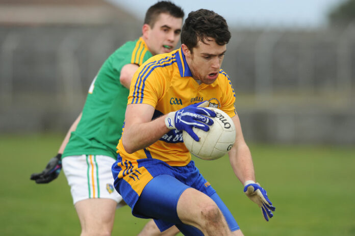 Shane Brennan under pressure from Paddy Maguirein their Division 4 National Football League game at Miltown Malbay.