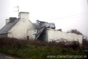  The roof from a shed begins to lift at a house near Doonbeg on Wednesday. Photograph by Arthur Ellis.