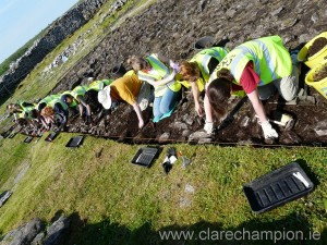 Students excavating in the sunshine.  Photograph by John Kelly