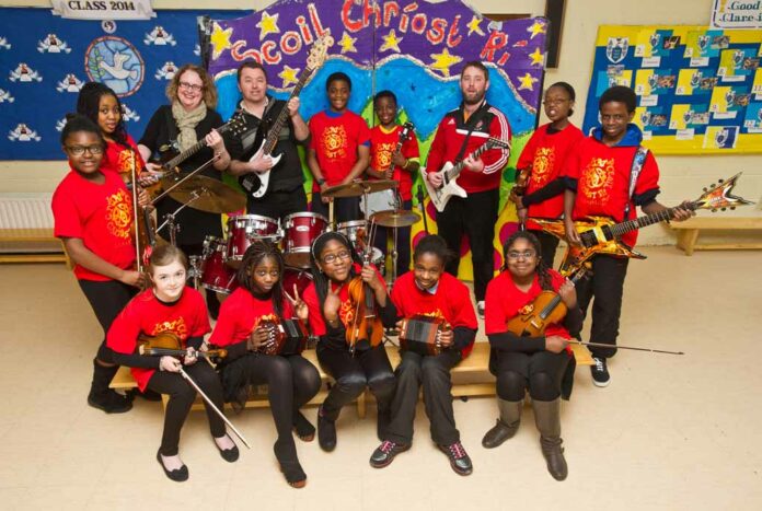 A group of Scoil Chriost Ri, Cloughleigh, Ennis, pupils who have been short listed for the finals of the Comortas Amhran Naisunta at the National Pan Celtic finals in Carlow on Saturday night. Front from left; Lauren Cusack, Zarena Boladale, Rebecca Sobamiwa, Emma Ikiebey and Deborah Babajide. Back from left; Glodia Luyinduladio, Chelsea Mba Ileozor, Karen Vaughan and Joe Garry, teachers, Abdul Saidi, Roy Jones Mbou, Paul Crehan, teacher, Axelle Hakizimana and Dereck Sholarin. Missing from photo are; Leah Fawl and Emmanuel Ikiebey. Photograph by John Kelly.