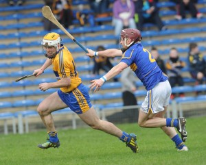 Conor Mc Grath of Clare  scores his third goal despite Paddy Stapleton of Tipperary during their National League game at Thurles. Photograph by John Kelly.