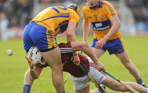 Daithi Burke of Galway gets the ball away between the legs of Clare's John Conlon during their NHL Division 1 Round 5 game at Cusack park, Ennis. Photograph by John Kelly.