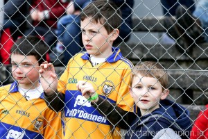  Clare fans Darragh Moroney (9), Liam Boyce (11) and Finn Boyce (7) watching their team in action at Cusack Park Ennis on Sunday. Photograph by Arthur Ellis.