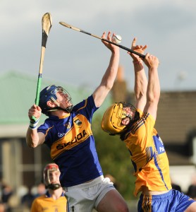 Michael Dunne of Tipperary in action against Ciaran Cooney and Seamus Downey of Clare during their Munster Minor Championship game at Cusack Park. Photograph by John Kelly.