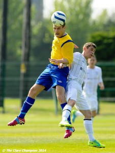 Colin Smyth of Clare League in action against Stuart Glynn of AUL Dublin during the Oscar Traynor Trophy Final at AUL Complex, Clonshaugh, Dublin. Photograph by John Kelly.