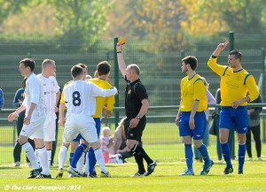 Referee Oliver Falsey sends off  of AUL Dublin in action against XX of Clare League during the Oscar Traynor Trophy Final at AUL Complex, Clonshaugh, Dublin. Photograph by John Kelly.