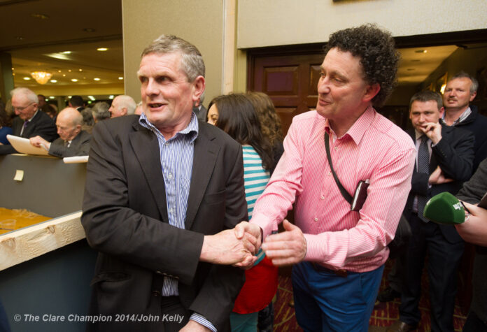 Poll topper in Killaloe area Joe Cooney is congratulated by fellow Fine Gael candidate Johnny Flynn during the election count at The West county Hotel, Ennis. Photograph by John Kelly.