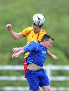 Avenue Utd's David Russell rises above Adrian Walsh. Photograph by Declan Monaghan