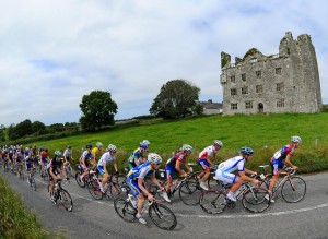 A general view of the action as the peloton pass the ruins of Leamaneh Castle during Stage 4 on the 2013 Junior Tour of Ireland. Picture credit: Stephen McMahon / SPORTSFILE