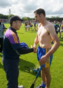 Wexford manager Liam Dunne gets Brendan Bugler's jersey from him following their All-Ireland qualifier game at Cusack Park. Photograph by John Kelly