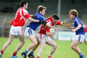 Cratloe's Cathal McInerney and Podge Collins battle with Eire Og's Donie Lyne and Liam Corry during their Senior Football game at Cusack park Ennis on Saturday evening. Pic Arthur Ellis.