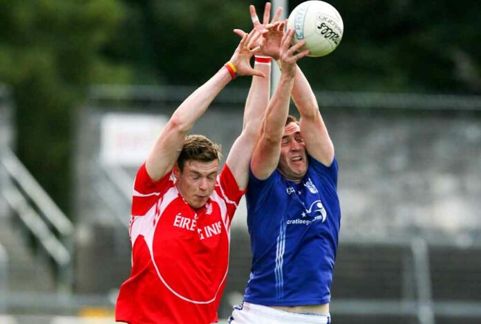 Cratloe's Cillian Duggan battles with Eire Og's Darren O'Neill during their Senior Football game at Cusack park Ennis on Saturday evening. Pic Arthur Ellis.