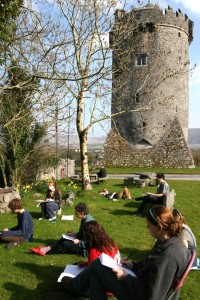 Students working in the shadow of Newtown Castle at the Burren College of Art.