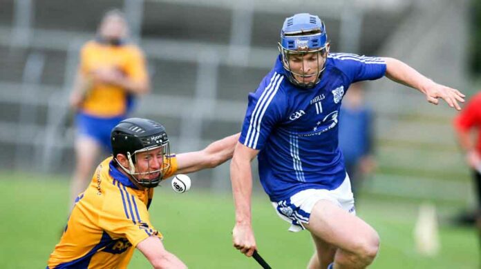 Cratloe's Podge Collins battles with Sixmilebridges Tadgh Keogh during their Senior Hurling Championship game at Cusack Park Ennis on saturday.