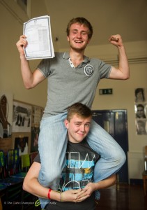 Tim Janson is lifted shoulder high by his friend Mark Kenny while meeting at Ennis Youth Centre for breakfast after Tim collected his results on Wednesday morning at the Ennis Youth Centre. Photograph by John Kelly.