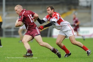 Niall Kelly of Lissycasey in action against Sean O Meara of Eire Og during their senior championship game in Cusack park. Photograph by John Kelly.