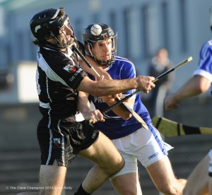 Eric Flynn of Clarecastle in action against Micheal Hawes of Cratloe during their semi-final at Cusack Park. Photograph by John Kelly.