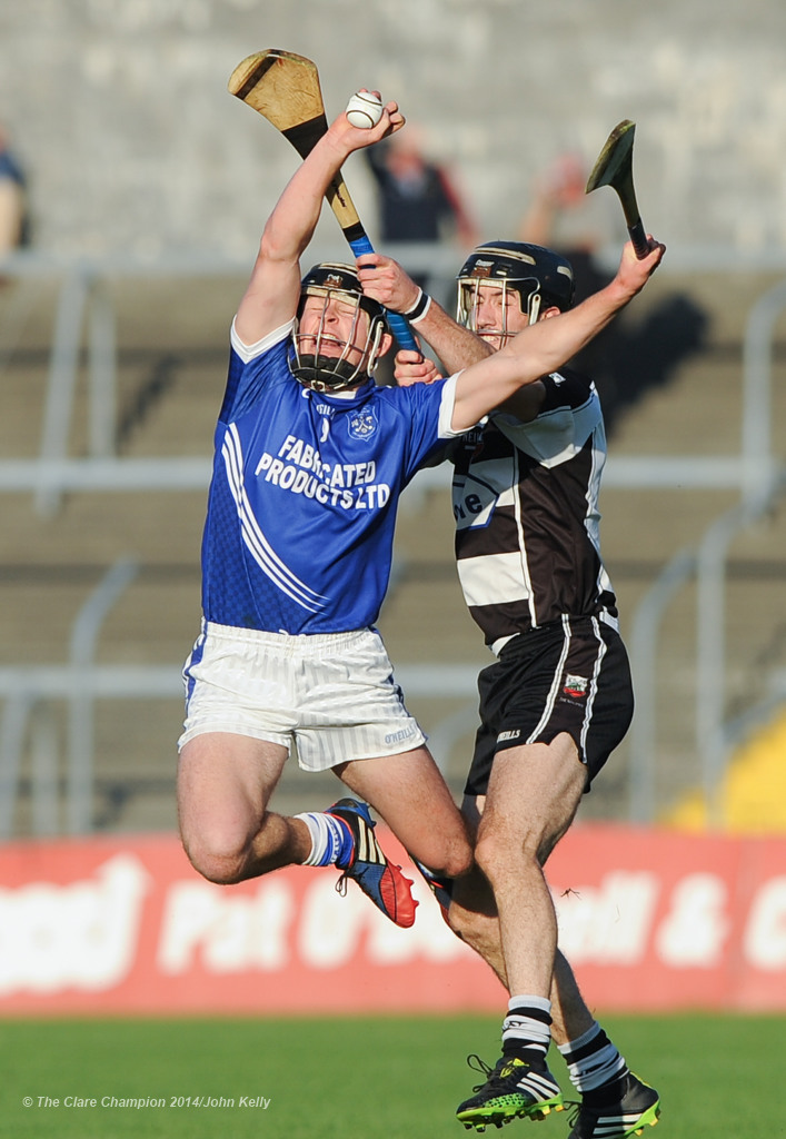 Liam Markham of Cratloe in action against Stephen O Halloran of Clarecastle during their semi-final at Cusack Park. Photograph by John Kelly.