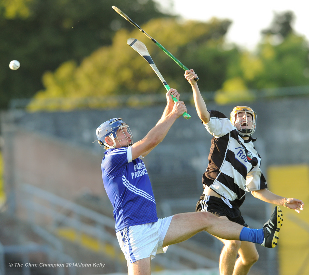 Conor Ryan of Cratloe in action against Stephen Ward of Clarecastle during their semi-final at Cusack Park. Photograph by John Kelly.