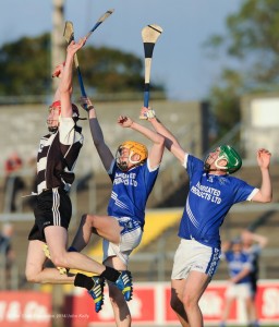 Patrick Kelly of Clarecastle in action against David Collins and Cathal Mc Inerney of Cratloe during their semi-final at Cusack Park. Photograph by John Kelly.