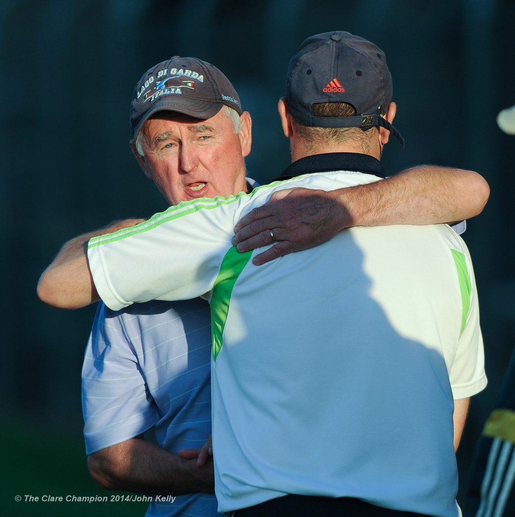 Cratloe manager Joe Mc Grath and Clarecastle coach Fergus O Loughlin embrace after their semi-final at Cusack Park. Photograph by John Kelly.