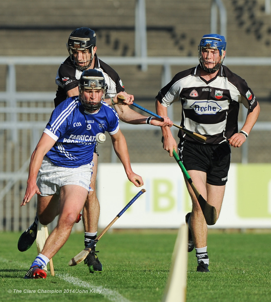 Liam Markham of Cratloe in action against Stephen O Halloran and Bobby Duggan of Clarecastle during their semi-final at Cusack Park. Photograph by John Kelly.