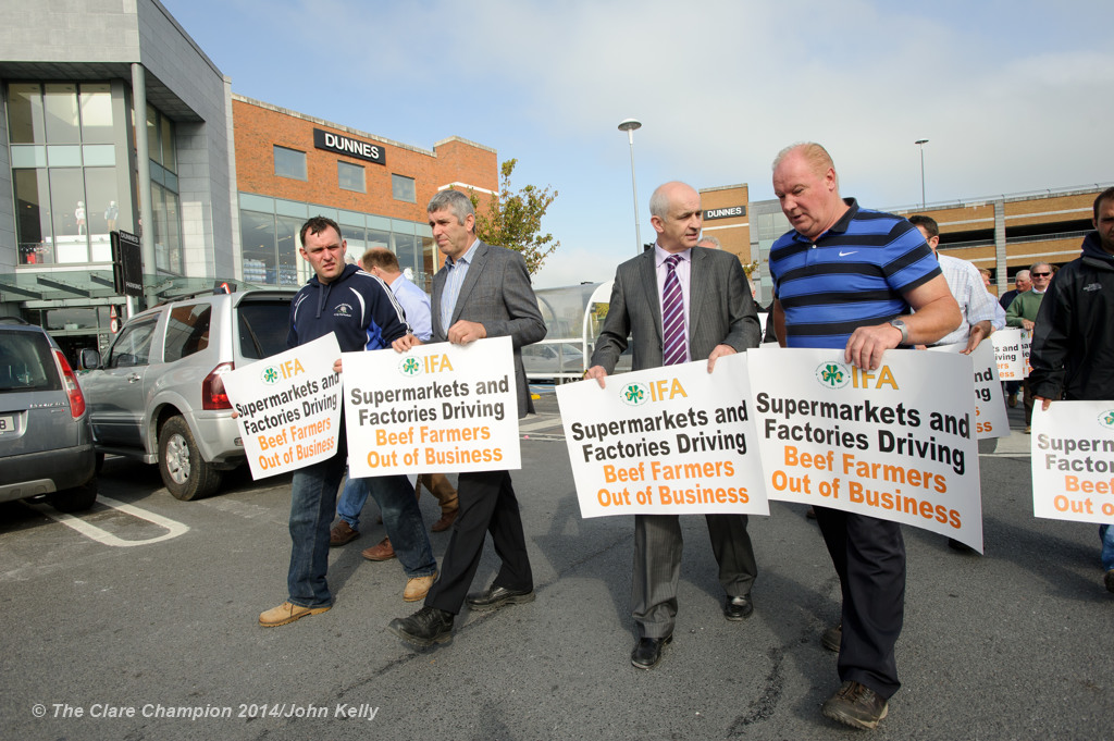 Clare IFA chairman Andrew Dundas and national chairman Eddie Dowling, centre,  marching with IFA members during the Clare IFA Beef price protest outside Dunnes Stores in Ennis as part of their national campaign. Photograph by John Kelly.