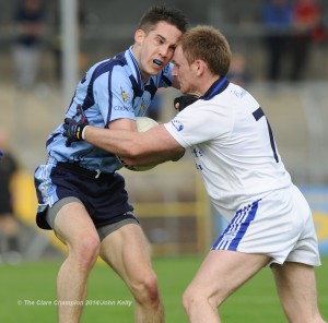 Cooraclare's  Cathal Lillis goes eye to eye with Cratloe's  Enda Boyce during their semi final at Cusack park. Photograph by John Kelly.