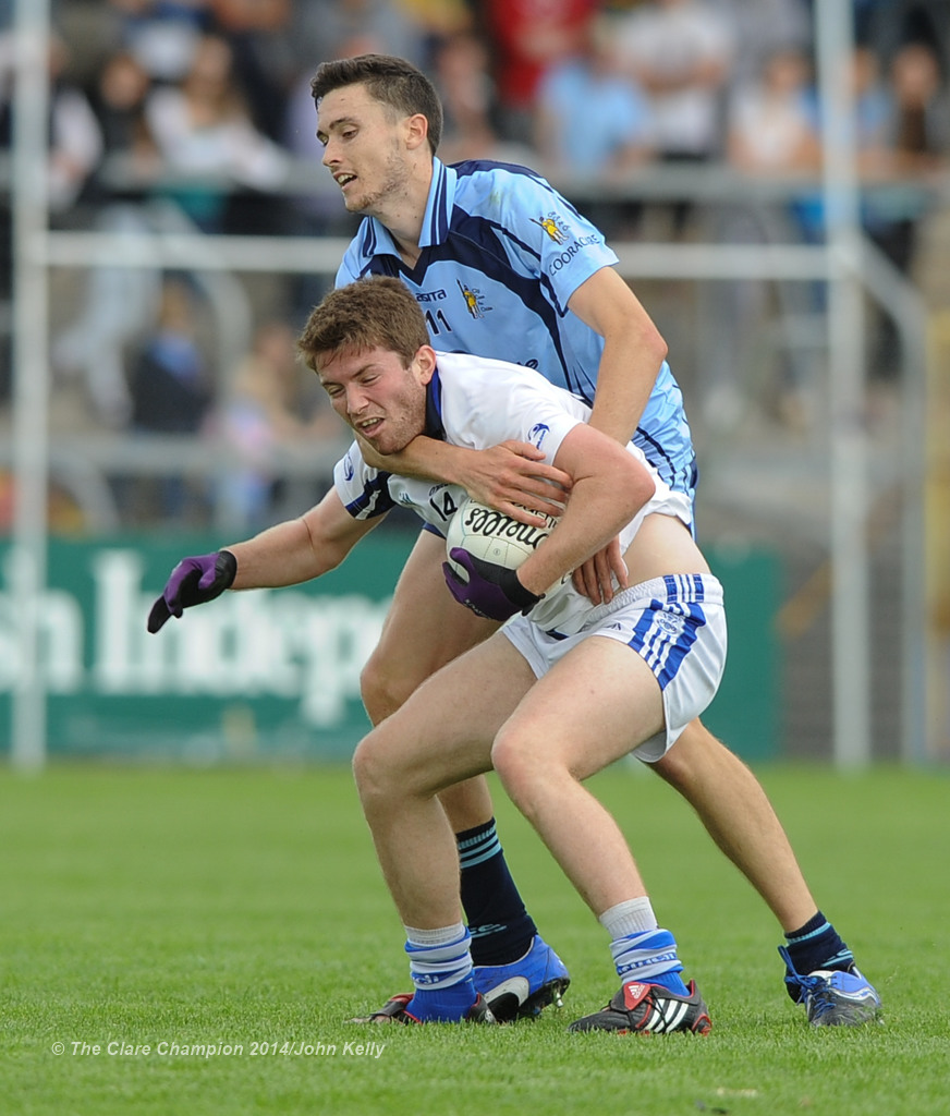 Cooraclare's  Damien Burke tussles with Cratloe's Cathal Mc Inerney during their semi final at Cusack park. Photograph by John Kelly.