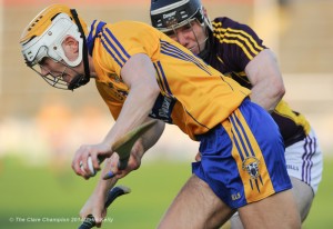 Aaron Cunningham of Clare in action against Andrew Kenny of Wexford during the All-Ireland U-21 final in Semple Stadium, Thurles. Photograph by John Kelly.