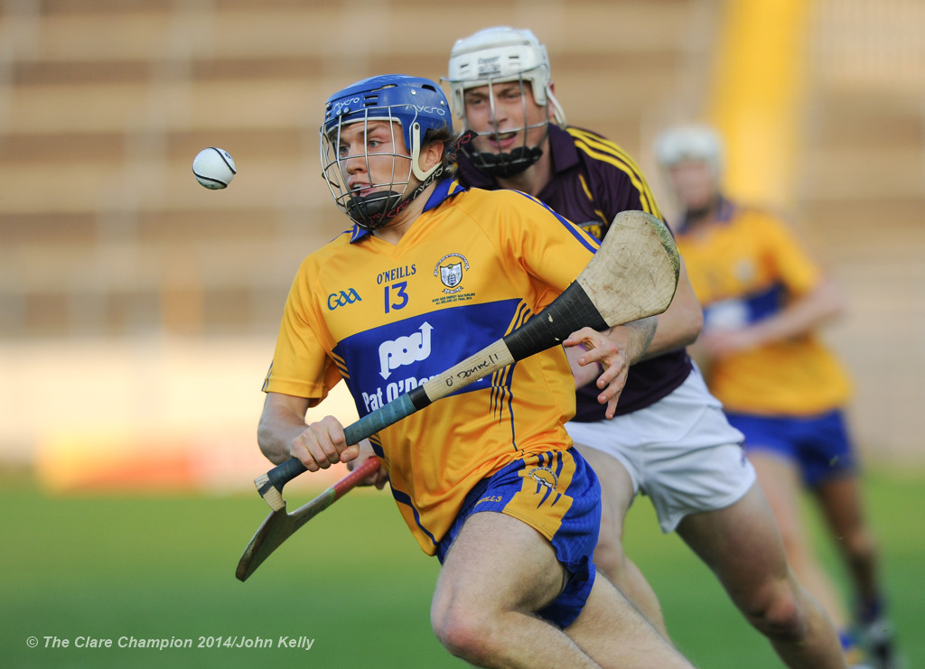 Shane O Donnell of Clare in action against Liam Ryan of Wexford during the All-Ireland U-21 final in Semple Stadium, Thurles. Photograph by John Kelly.