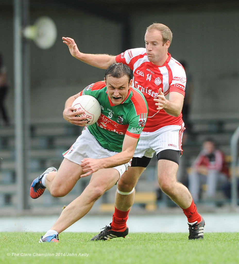 Peter O Dwyer of Kilmurry Ibrickane in action against Stephen Hickey of Eire Og during their senior championship semi-final at Kilmihil. Photograph by John Kelly.