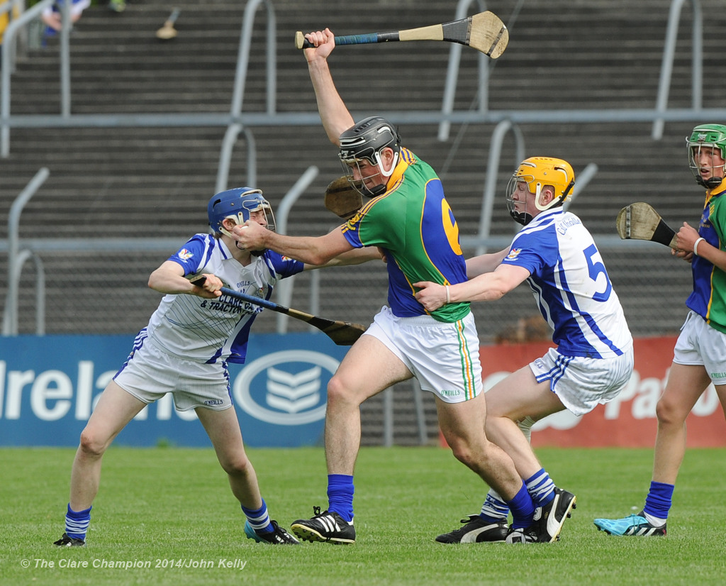 Con Smyth of Feakle/Killanena in action against Sean Kennedy and Padraig O Conor of Kilmaley during their Minor A county final at Cusack Park Photograph by John Kelly.